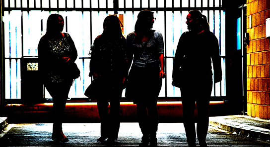 Women walking through prison